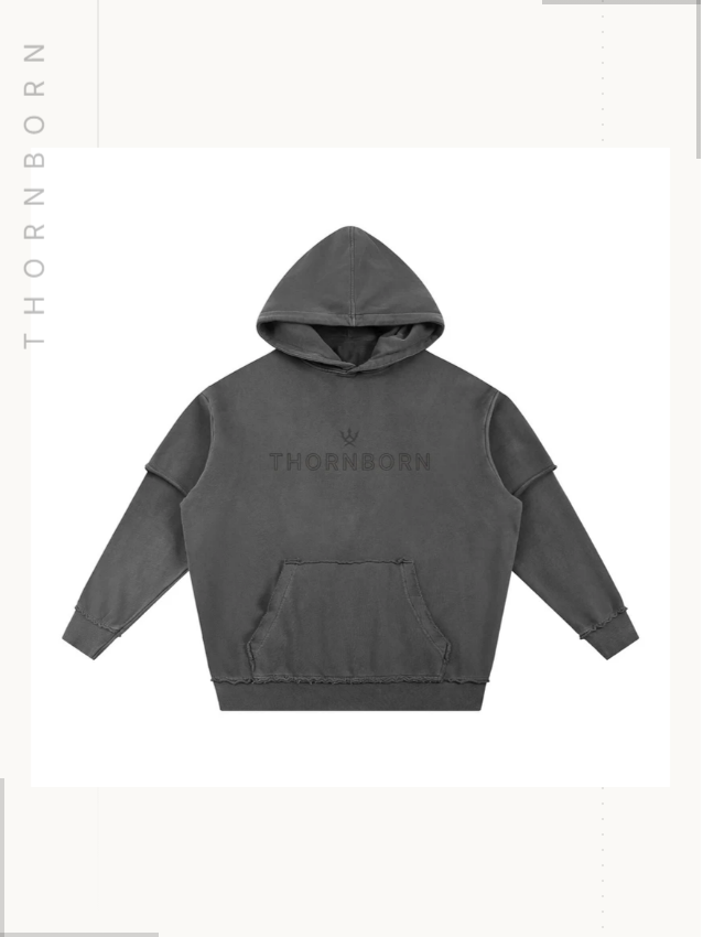 Thornborn hoodie — centred product photography on a quiet ground